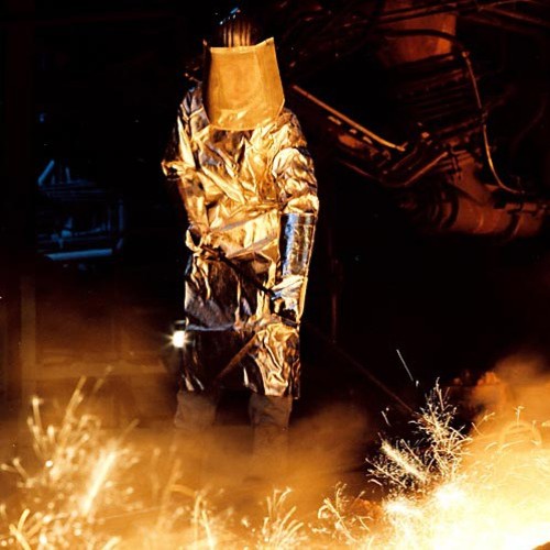 Picture of a man working in the steel and metal industry, showing the extreme conditions that require the use of NSK steel industry bearings.